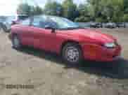 1999 Saturn SC with VIN 1G8ZP128XXZ252270, listed as a Copart auction lot 81371645 with 76,945 mi miles and Salvage title. Bid and sale history available at DreamBid. Image 4.