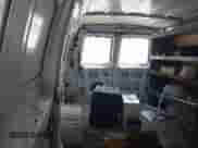 2009 Ford Econoline Cargo Commercial с VIN 1FTNE24W09DA75465, выставлен на аукционе IAAI как лот 43023522 с пробегом Не указан миль и . История ставок и продаж доступна на DreamBid. Изображение 8.