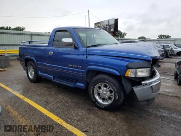 1997 Dodge 1500 with VIN 1B7HC16Z5VJ543075, listed as a Copart auction lot 63980615 with 124,583 mi miles and Salvage title. Bid and sale history available at DreamBid. Image 4.
