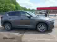 2022 Mazda CX-5 S Carbon Edition с VIN JM3KFBCM2N0629095, выставлен на аукционе IAAI как лот 42177130 с пробегом 28 913 миль миль и . История ставок и продаж доступна на DreamBid. Изображение 13.