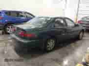 1997 Toyota Camry LE z VIN 4T1BF22K5VU903726, wystawiony jako IAAI lot #41552016 z przebiegiem 121 079 mil mil oraz . Historia ofert i sprzedaży dostępna na DreamBid. Obrazek 4.