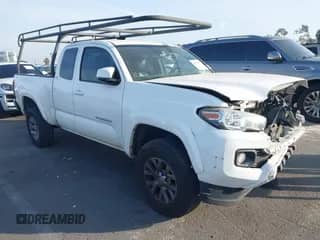 2018 Toyota Tacoma SR5 with VIN 5TFRZ5CN3JX064821, listed as a IAAI auction lot 41478807 with 106,495 mi miles and . Bid and sale history available at DreamBid. Image 1.