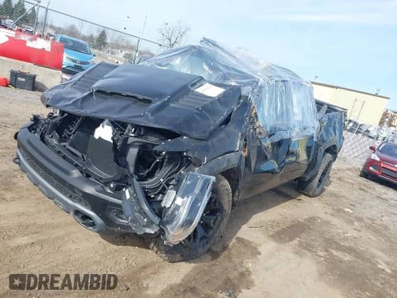 2024 Ram 1500 TRX with VIN 1C6SRFU95RN113699, listed as a IAAI auction lot 41554126 with 3,750 mi miles and . Bid and sale history available at DreamBid. Image 2.