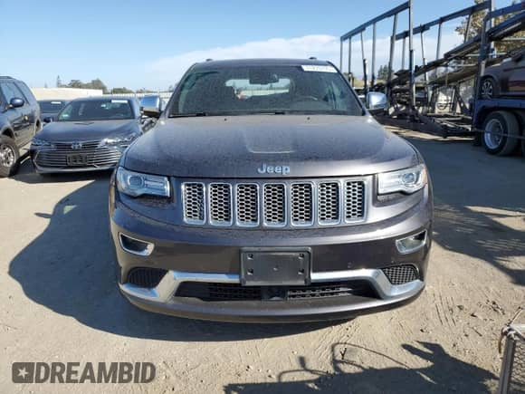 2014 Jeep Grand Cherokee Summit with VIN 1C4RJFJM6EC340672, listed as a Copart auction lot 71270735 with 49,538 mi miles and Salvage title. Bid and sale history available at DreamBid. Image 5.
