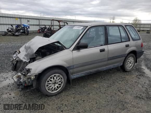 1990 Honda Civic with VIN JHMEE2754LS010638, listed as a Copart auction lot 85169464 with 167,566 mi miles and Salvage title. Bid and sale history available at DreamBid. Image 1.
