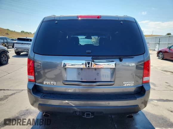 2010 Honda Pilot Touring with VIN 5FNYF4H84AB025991, listed as a Copart auction lot 71250615 with 121,648 mi miles and Salvage title. Bid and sale history available at DreamBid. Image 6.