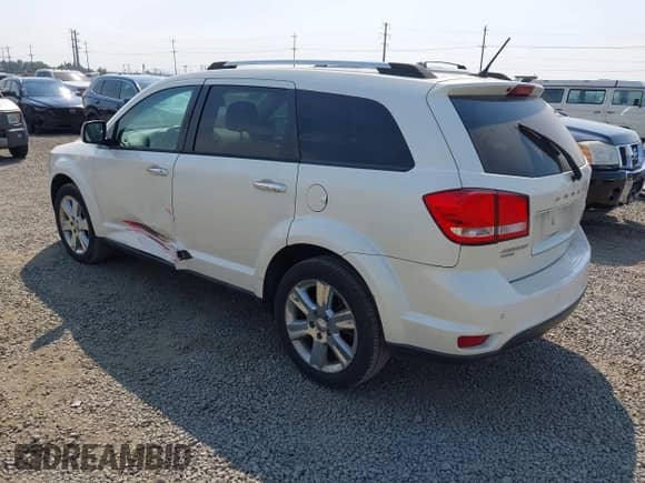 2013 Dodge Journey Crew with VIN 3C4PDDDG7DT535949, listed as a IAAI auction lot 43162161 with 173,974 mi miles and . Bid and sale history available at DreamBid. Image 3.