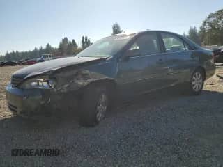 2002 Toyota Camry XLE with VIN JTDBF30K320043468, listed as a Copart auction lot 82289975 with 235,912 mi miles and Salvage title. Bid and sale history available at DreamBid. Image 1.