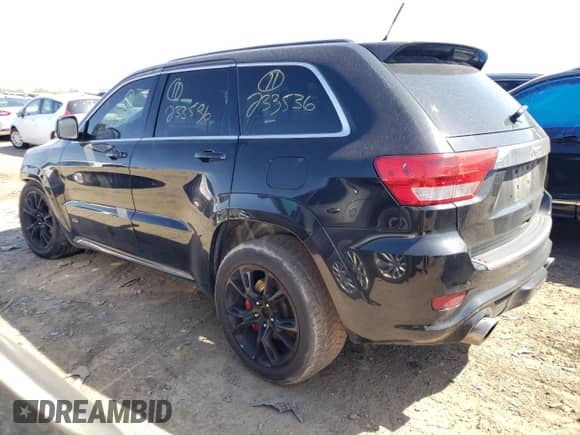2012 Jeep Grand Cherokee SRT-8 z VIN 1C4RJFDJ2CC352056, wystawiony jako Copart lot #48810994 z przebiegiem 114 807 mil mil oraz Szkoda całkowita • Salvage title. Historia ofert i sprzedaży dostępna na DreamBid. Obrazek 2.