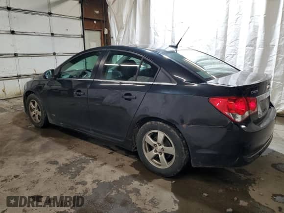 2014 Chevrolet Cruze 1LT z VIN 1G1PC5SBXE7295634, wystawiony jako Copart lot #82329965 z przebiegiem 139 795 mil mil oraz Szkoda całkowita • Salvage title. Historia ofert i sprzedaży dostępna na DreamBid. Obrazek 2.