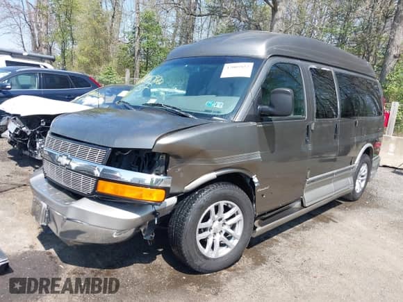 2004 Chevrolet Express Passenger with VIN 1GBFG15T641138032, listed as a IAAI auction lot 42005922 with 200,232 mi miles and . Bid and sale history available at DreamBid. Image 2.