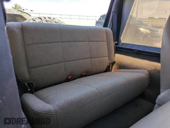 2002 Jeep Wrangler X z VIN 1J4FA39S22P776339, wystawiony jako Copart lot #57907165 z przebiegiem 154 088 mil mil oraz Szkoda całkowita • Salvage title. Historia ofert i sprzedaży dostępna na DreamBid. Obrazek 10.