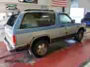 1990 Chevrolet Blazer with VIN 1GNCT18Z2L0107091, listed as a Copart auction lot 80714795 with 203,095 mi miles and Salvage title. Bid and sale history available at DreamBid. Image 3.