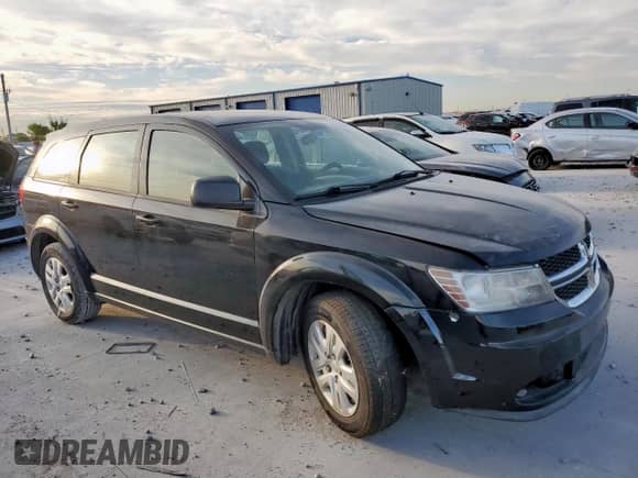 2014 Dodge Journey American Value with VIN 3C4PDCAB1ET283961, listed as a Copart auction lot 65348255 with 200,998 mi miles and Salvage title. Bid and sale history available at DreamBid. Image 4.