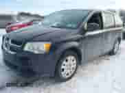 2014 Dodge Grand Caravan SXT with VIN 2C4RDGBGXER138141, listed as a IAAI auction lot 41201505 with 156,445 mi miles and . Bid and sale history available at DreamBid. Image 2.