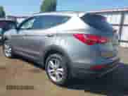 2014 Hyundai Santa Fe z VIN 5XYZUDLA8EG200097, wystawiony jako IAAI lot #43045747 z przebiegiem 31 772 mil mil oraz . Historia ofert i sprzedaży dostępna na DreamBid. Obrazek 3.