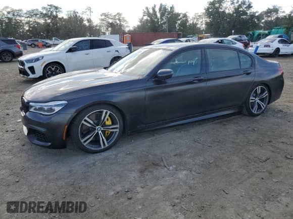 2019 BMW 7 Series 750i xDrive with VIN WBA7F2C58KB240403, listed as a Copart auction lot 84191915 with 56,854 mi miles and Salvage title. Bid and sale history available at DreamBid. Image 1.