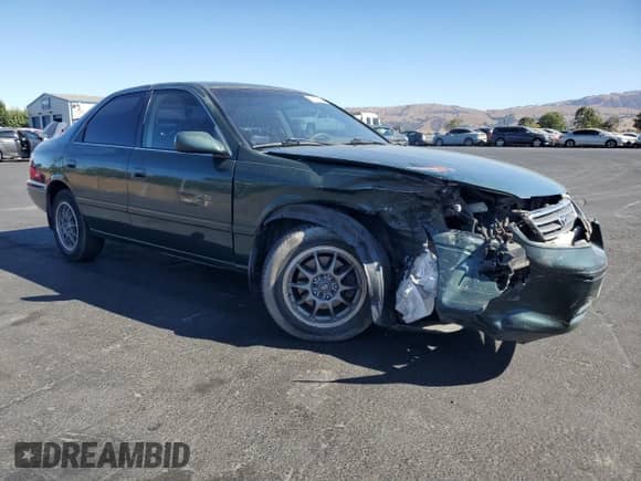 2001 Toyota Camry CE z VIN JT2BG22K410606619, wystawiony jako Copart lot #80817125 z przebiegiem 161 201 mil mil oraz Szkoda całkowita • Salvage title. Historia ofert i sprzedaży dostępna na DreamBid. Obrazek 4.