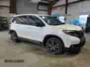 2020 Honda Passport EX-L with VIN 5FNYF8H51LB003575, listed as a Copart auction lot 54214965 with 61,791 mi miles and Salvage title. Bid and sale history available at DreamBid. Image 4.