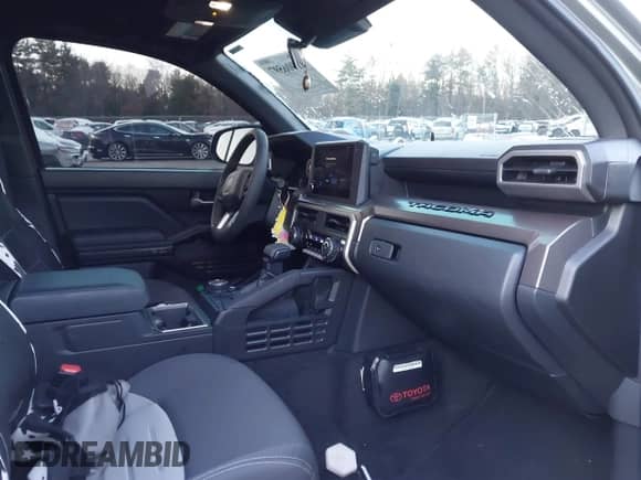 2024 Toyota Tacoma SR5 with VIN 3TMLB5JN9RM046175, listed as a IAAI auction lot 41006597 with 6,139 mi miles and . Bid and sale history available at DreamBid. Image 5.