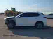 2024 Mazda CX-5 S Select z VIN JM3KFBBL9R0408107, wystawiony jako IAAI lot #43185801 z przebiegiem 9 809 mil mil oraz . Historia ofert i sprzedaży dostępna na DreamBid. Obrazek 14.
