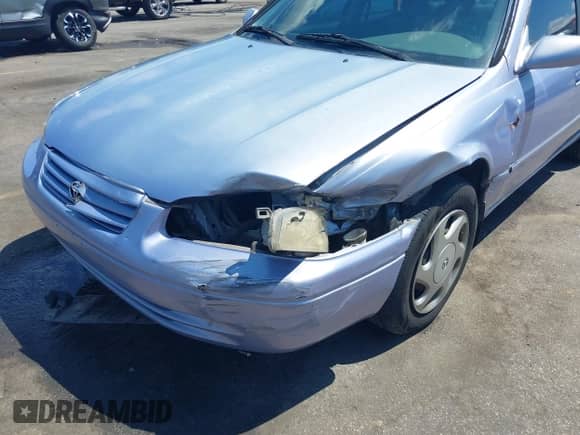 1997 Toyota Camry LE z VIN JT2BF22K2V0021868, wystawiony jako IAAI lot #43070012 z przebiegiem 128 808 mil mil oraz . Historia ofert i sprzedaży dostępna na DreamBid. Obrazek 6.