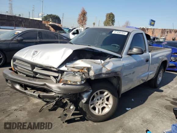 2002 Dodge Dakota z VIN 1B7FL16X72S632397, wystawiony jako Copart lot #87450164 z przebiegiem Nie podano mil oraz Szkoda całkowita • Salvage title. Historia ofert i sprzedaży dostępna na DreamBid. Obrazek 1.