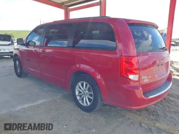 2014 Dodge Grand Caravan SXT with VIN 2C4RDGCG4ER129711, listed as a IAAI auction lot 43317873 with 164,242 mi miles and . Bid and sale history available at DreamBid. Image 3.