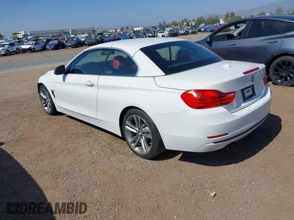 2015 BMW 4 Series 428i with VIN WBA3V7C58FP771642, listed as a IAAI auction lot 42524828 with 64,440 mi miles and . Bid and sale history available at DreamBid. Image 3.