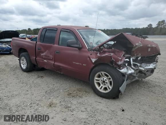 2001 Dodge Dakota Sport with VIN 1B7GL2AX01S140620, listed as a Copart auction lot 51509765 with 230,213 mi miles and Salvage title. Bid and sale history available at DreamBid. Image 4.