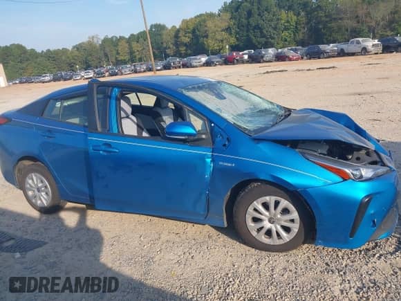 2021 Toyota Prius L Eco with VIN JTDKAMFU1M3136133, listed as a IAAI auction lot 43285926 with 49,911 mi miles and . Bid and sale history available at DreamBid. Image 12.