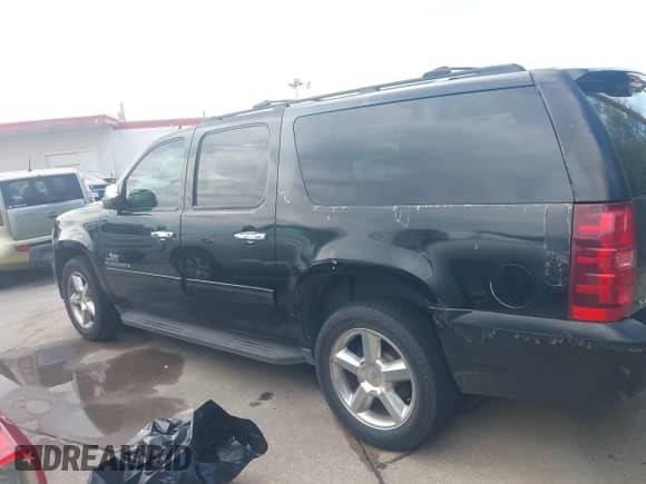 2013 Chevrolet Suburban LT with VIN 1GNSCJE00DR337906, listed as a IAAI auction lot 43466723 with 167,524 mi miles and . Bid and sale history available at DreamBid. Image 14.