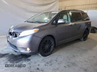 2012 Toyota Sienna XLE with VIN 5TDDK3DC9CS033551, listed as a Copart auction lot 69910445 with 210,288 mi miles and Salvage title. Bid and sale history available at DreamBid. Image 1.