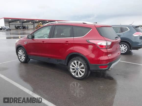 2017 Ford Escape Titanium z VIN 1FMCU9J97HUA95899, wystawiony jako IAAI lot #43365600 z przebiegiem 95 376 mil mil oraz . Historia ofert i sprzedaży dostępna na DreamBid. Obrazek 3.