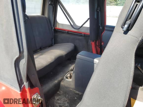 2004 Jeep Wrangler Sport z VIN 1J4FA49S74P768715, wystawiony jako Copart lot #69984725 z przebiegiem 91 803 mil mil oraz Czysty tytuł • Clean title. Historia ofert i sprzedaży dostępna na DreamBid. Obrazek 10.