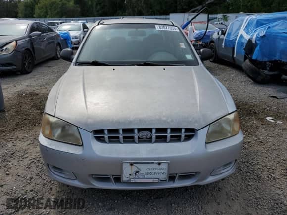 2002 Hyundai Accent GL z VIN KMHCG45C12U398748, wystawiony jako Copart lot #82077055 z przebiegiem 175 456 mil mil oraz Czysty tytuł • Clean title. Historia ofert i sprzedaży dostępna na DreamBid. Obrazek 5.