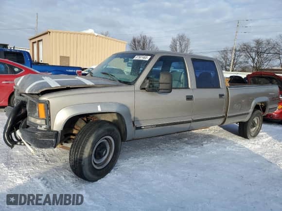 1999 Chevrolet Silverado 3500 z VIN 1GCHK33R4XF096473, wystawiony jako Copart lot #87587465 z przebiegiem 174 424 mil mil oraz Szkoda całkowita • Salvage title. Historia ofert i sprzedaży dostępna na DreamBid. Obrazek 1.