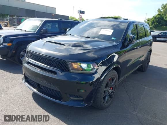 2018 Dodge Durango SRT with VIN 1C4SDJGJ5JC142443, listed as a IAAI auction lot 42401246 with 106,260 mi miles and . Bid and sale history available at DreamBid. Image 22.