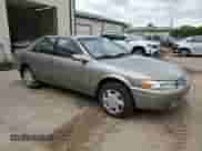 1997 Toyota Camry LE z VIN JT2BF22K2V0048990, wystawiony jako Copart lot #58781925 z przebiegiem 146 216 mil mil oraz Szkoda całkowita • Salvage title. Historia ofert i sprzedaży dostępna na DreamBid. Obrazek 4.