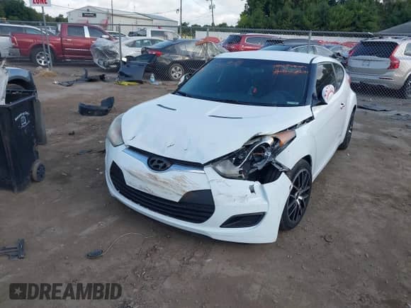 2014 Hyundai Veloster z VIN KMHTC6AD0EU204382, wystawiony jako IAAI lot #40287015 z przebiegiem 110 460 mil mil oraz . Historia ofert i sprzedaży dostępna na DreamBid. Obrazek 2.