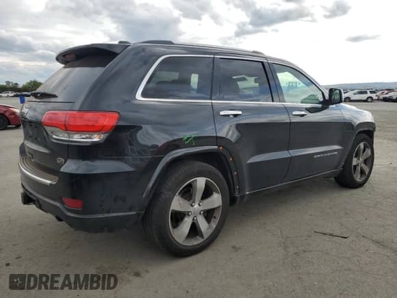 2016 Jeep Grand Cherokee Overland with VIN 1C4RJFCG6GC489769, listed as a Copart auction lot 82302855 with 136,225 mi miles and Salvage title. Bid and sale history available at DreamBid. Image 3.