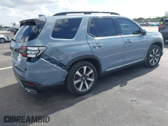 2024 Honda Pilot Elite with VIN 5FNYG1H84RB015114, listed as a IAAI auction lot 43082030 with 26,877 mi miles and . Bid and sale history available at DreamBid. Image 4.