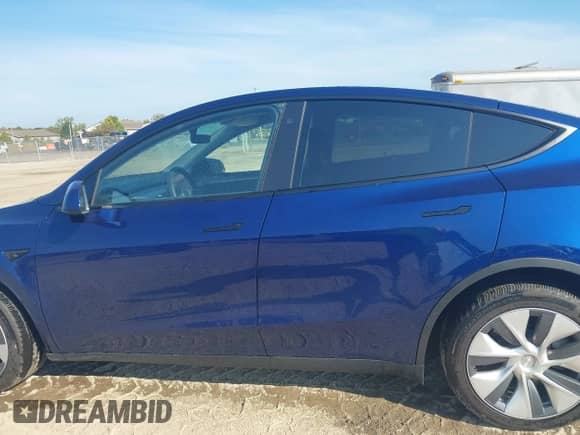 2023 Tesla Model Y Long Range with VIN 7SAYGDEE4PA125024, listed as a IAAI auction lot 43252218 with 21,200 mi miles and . Bid and sale history available at DreamBid. Image 15.