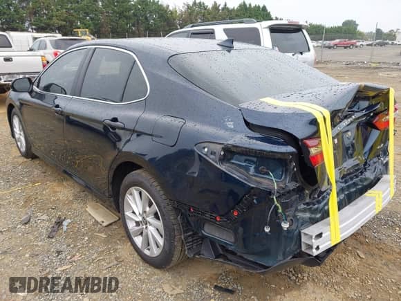 2021 Toyota Camry LE with VIN 4T1C11AK8MU548158, listed as a IAAI auction lot 43333222 with 34,824 mi miles and . Bid and sale history available at DreamBid. Image 3.