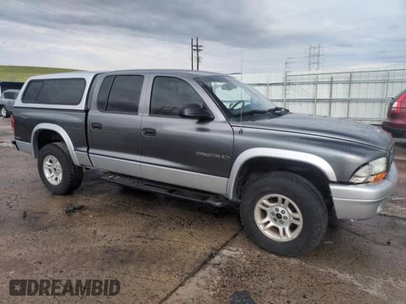 2002 Dodge Dakota SLT with VIN 1B7HG48N52S584957, listed as a Copart auction lot 55178675 with 175,894 mi miles and Salvage title. Bid and sale history available at DreamBid. Image 4.