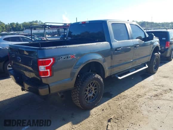 2020 Ford F-150 XLT with VIN 1FTEW1E53LFC30261, listed as a IAAI auction lot 43365752 with 125,373 mi miles and . Bid and sale history available at DreamBid. Image 4.