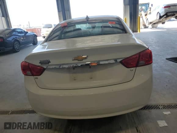 2018 Chevrolet Impala LT with VIN 2G1105S32J9143833, listed as a Copart auction lot 71262125 with Not provided miles and Salvage title. Bid and sale history available at DreamBid. Image 6.