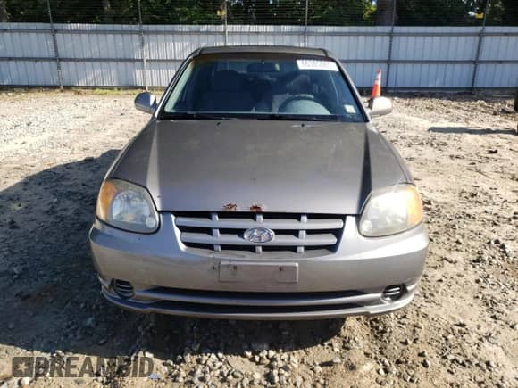 2004 Hyundai Accent GL z VIN KMHCG45C64U506817, wystawiony jako Copart lot #66365085 z przebiegiem 58 940 mil mil oraz Szkoda całkowita • Salvage title. Historia ofert i sprzedaży dostępna na DreamBid. Obrazek 5.