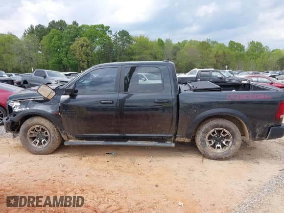 2018 Ram 1500 Rebel with VIN 1C6RR7YT4JS151036, listed as a IAAI auction lot 41988370 with 72,587 mi miles and . Bid and sale history available at DreamBid. Image 15.