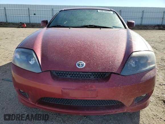2006 Hyundai Tiburon GS с VIN KMHHM65D56U211049, выставлен на аукционе Copart как лот 44816025 с пробегом 123 030 миль миль и Списание • Salvage title. История ставок и продаж доступна на DreamBid. Изображение 5.